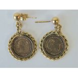 A pair of 1882 Victoria two pence coins, set within 9ct gold earring mounts, hallmarked 375,