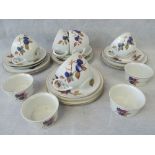 A part Royal Worcester Evesham pattern tea set: four ramekin dishes; five cups;
