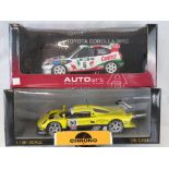 Two UT Model die-cast racing cars: a model of a McLaren Collection BMW powered car together with an