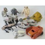 A collection of original Star Wars toy action figures and vehicles: Jabba the Hut;