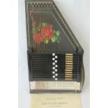 A boxed mid 20th century Autoharp complete with original instructions 'to be learnt in one hour'.