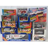 A collection of 13 Corgi die-cast model vehicles including a limited edition John Force two car set;