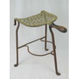 An early 19th century pierced brass and iron fireside trivet standing 34cm high,