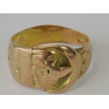 A 9ct rose gold buckle design ring, rubbed hallmark for 9ct, size I, 3.