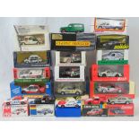 18 die-cast model racing cars, all with original packaging or presentation cases,