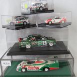 A die-cast model Tamiya Nissan in a plastic presentation case together with a Porsche and three