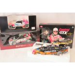 Three die-cast model racing cars: an Action NHRA Castrol GTX John Force Mustang Elvis Presley car;