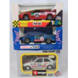 Five die-cast model racing cars: a Burago Ford escort XR3 together with models by Polistil and