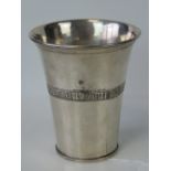 A white metal beaker bearing Gothic inscription, marked to base 'G' within a six pointed star, 7.