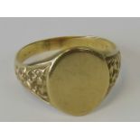 A gold signet ring, unengraved head, hallmarks worn, probably 9ct, size S, 4.