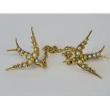 A delightful yellow metal and seed pearl collar brooch featuring two swallows united by a section