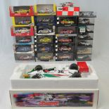 Over 20 die-cast model racing cars all with original packaging or presentation cases,