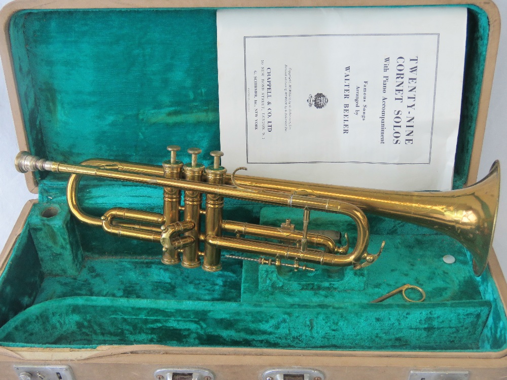 A cased trumpet bearing serial No 630108 upon, box with label for Bill Leington Ltd London upon,