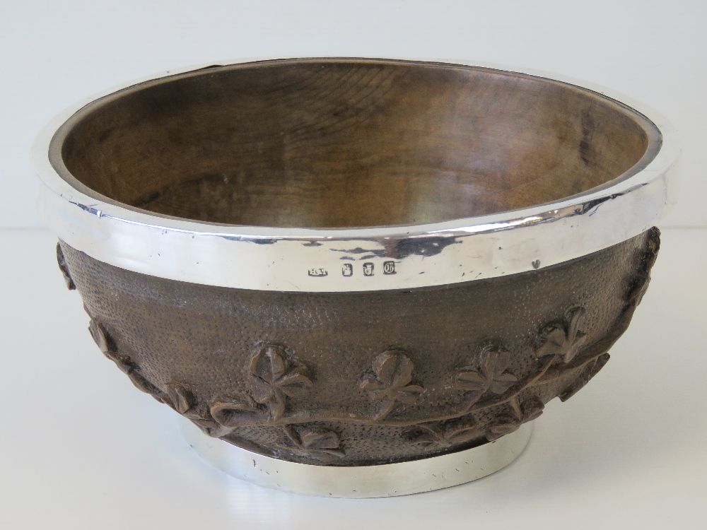 An unusual Irish hand-carved wooden bowl bearing silver hallmarks for Dublin 1902 and having