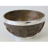 An unusual Irish hand-carved wooden bowl bearing silver hallmarks for Dublin 1902 and having