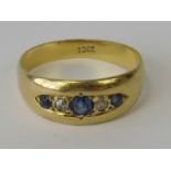 An 18ct gold sapphire and diamond gypsy ring,