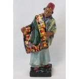 A Royal Doulton figurine 'The Carpet Seller' HN1464, standing 23cm high, fine condition throughout.