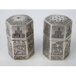 A pair of hexagonal Persian silver salt and pepper pots, marks to base.