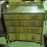 A chest of four graduating walnut drawers.