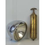 A brass automotive fire extinguisher by Pyrene,