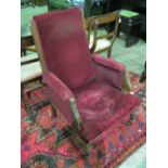 For restoration: an Edwardian overstuffed velvet covered armchair over turned legs.