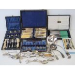 A large quantity of assorted silver plated flatware including; large ladle, small ladle,