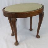 A c1930s oval dressing table stool with drop in set.