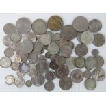 A quantity of assorted cupro-nickle coinage including British QEII crowns, Australian florins,