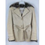 Karen Millen; a 100% leather coat with sheepskin collar and cuffs, size 8 (approx sizes; waist 76cm,