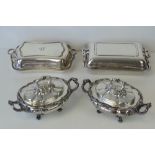 A pair of silver plated tureens, gadrooned body, complete with lids and twin end handles,