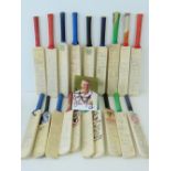 An extraordinary collection of nineteen miniature cricket bats,