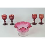 A set of four ruby glass Bohemian tot cups, together with a cranberry glass pedestal bowl.