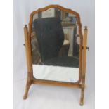 A delicate late 19th century shaped top toilet mirror, 37cm wide.