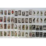 An album containing a large collection of mainly Ogdens cigarette cards,