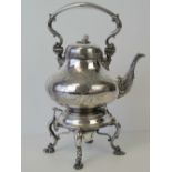 A large and impressive silver plated hot water pot with swing handle,