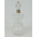 An unusual HM silver and cut glass waisted perfume bottle, silver collar marked for Birmingham 1911,