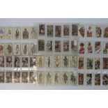 An album containing a large collection of mainly Players cigarette cards,
