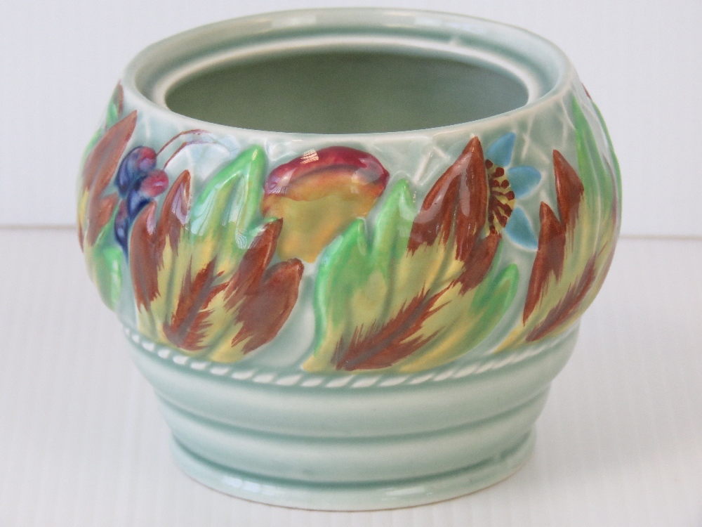 A Clarice Cliff hand painted preserve pot (without its lid); stamped “37A Newport Pottery Co.
