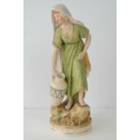 An early Royal Dux figurine of a lady carrying a large water jug, pink triangle mark to base, 28cm.