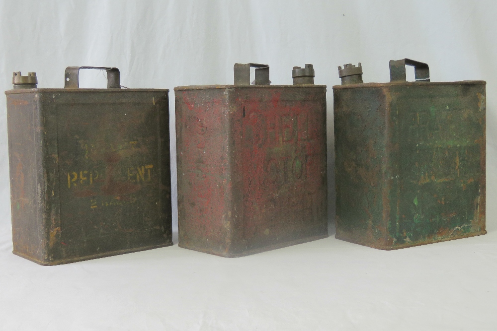 Three pre-war 2-Gallon petrol cans including Pratts Motor Spirit, etc.