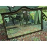 A fine quality overmantel mirror in walnut frame possibly by Maples. With suspension chain.