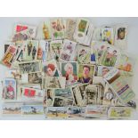 An assortment of cigarette cards, mainly Players, Wills and Churchmans,