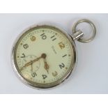 A military pocket watch by Grana, white metal case stamped with broad arrow G.S.T.P. J.