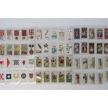 An album containing a large collection of mainly Players cigarette cards,