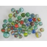 Approx 46 vintage glass assorted 'cats eye' marbles including single ball bearing and also two