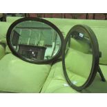 An oval freestanding easel back mirror in mahogany frame, standing 62cm high,