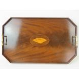 A mahogany butlers tray having brass end handles and inlaid Conch shell.