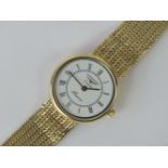 A 9ct gold Longines Presence ladies Quartz with integral 9ct gold strap, glass loose a/f,