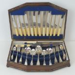 A canteen of cutlery for six persons including; carving set, knives, forks, spoons,