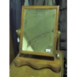 A Victorian mahogany squares shaped toilet mirror raised over serpentine base, a/f.